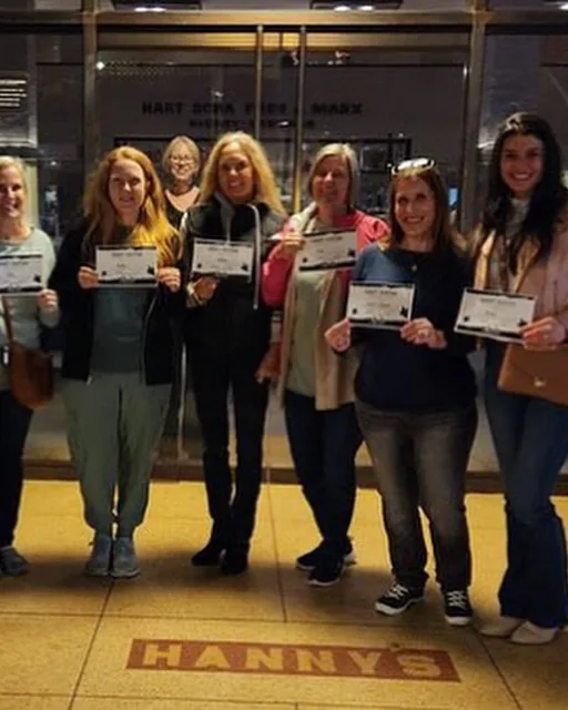 Get Ghosted Phoenix guests holding their certificates at Hanny's after the tour