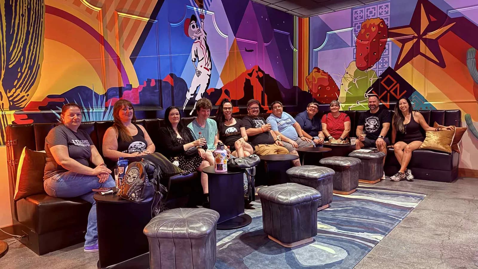 Monsters, Mobsters & Mayhem guests gathered in a colorful lounge