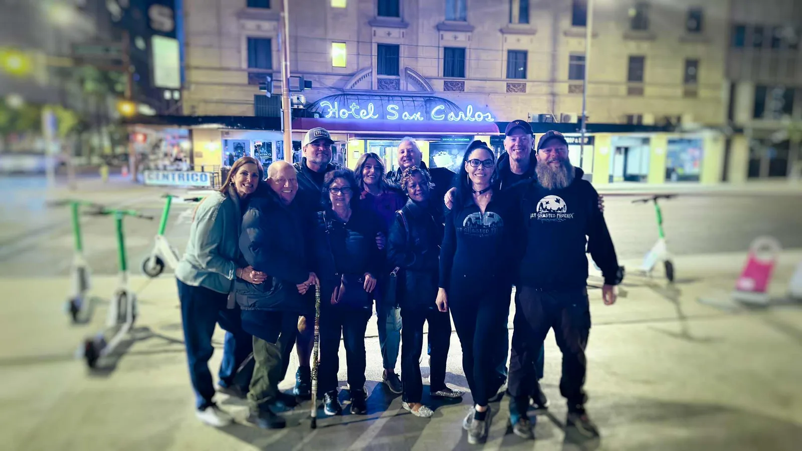 The Screamix group outside Hotel San Carlos at night